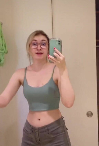 5. Titillating Sydney Shows Cleavage in Olive Crop Top