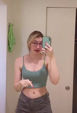 3. Sweetie Sydney Shows Cleavage in Olive Crop Top