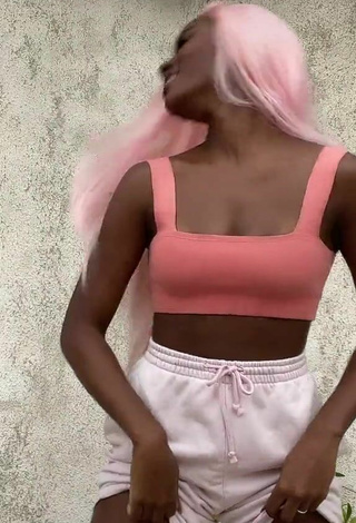 Luscious Mirella Qualha Shows Cleavage in Peach Crop Top