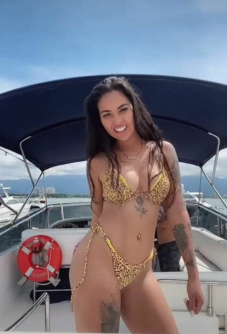 5. Sexy Pamella Fuego Shows Cleavage in Leopard Bikini on a Boat