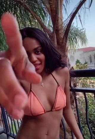 Sultry China Anne McClain in Peach Bikini Top on the Balcony