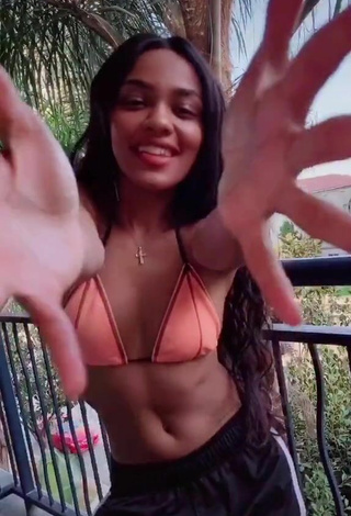 2. Sultry China Anne McClain in Peach Bikini Top on the Balcony