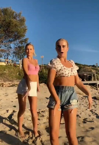 Beautiful Caitlin Cummins in Sexy Pink Crop Top at the Beach