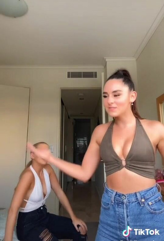 4. Titillating Caitlin Cummins Shows Cleavage in Olive Crop Top