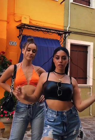 Cute Carla Flila Shows Cleavage in Orange Crop Top