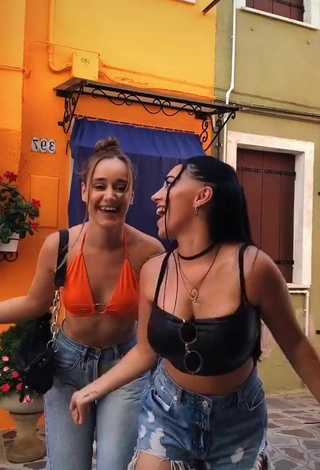 5. Cute Carla Flila Shows Cleavage in Orange Crop Top