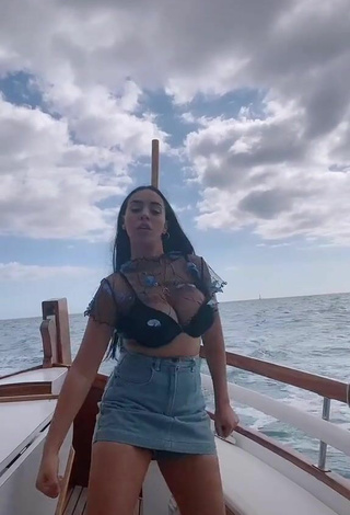 2. Luscious Carla Flila Shows Cleavage in Black Bra on a Boat