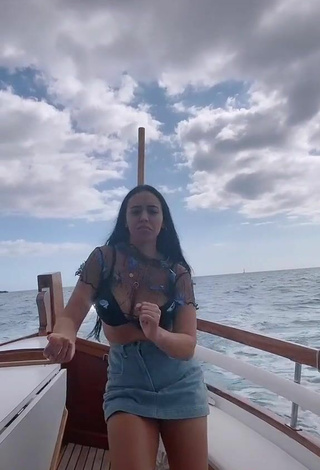 3. Luscious Carla Flila Shows Cleavage in Black Bra on a Boat