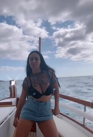 5. Luscious Carla Flila Shows Cleavage in Black Bra on a Boat