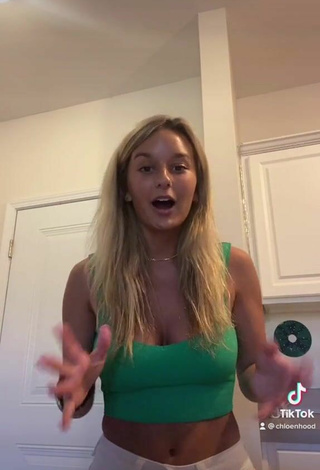 5. Luscious Chloe Hood Shows Cleavage in Green Crop Top