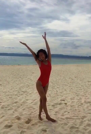 Sultry Edina Enriquez in Red Swimsuit at the Beach