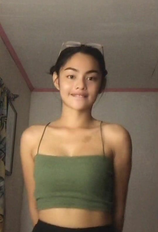 2. Titillating Isabel Luche Shows Cleavage in Olive Crop Top