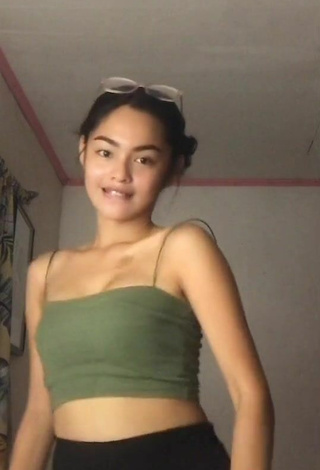 5. Titillating Isabel Luche Shows Cleavage in Olive Crop Top