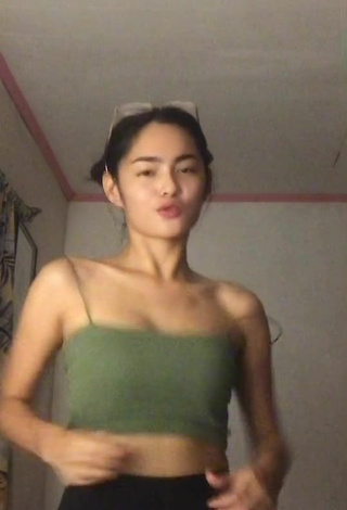 6. Titillating Isabel Luche Shows Cleavage in Olive Crop Top