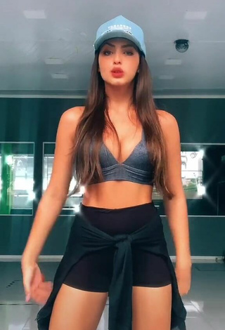 Cute Isa Pinheiro Shows Cleavage in Grey Sport Bra