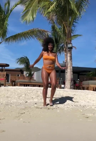 3. Sultry Joanne Lopes in Orange Bikini at the Beach