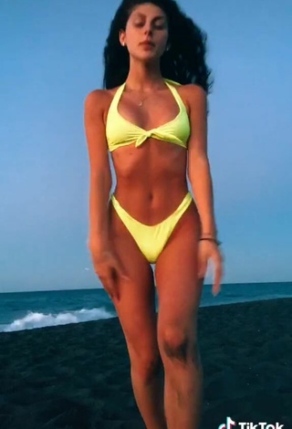 5. Luscious Ginevra Giaccherini Shows Cleavage in Yellow Bikini at the Beach