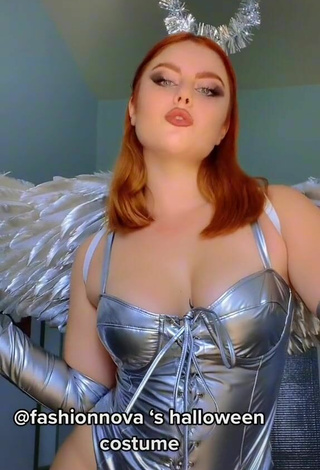 3. Sultry Giorgia Cavalluzzo Shows Cleavage in Silver Bodysuit