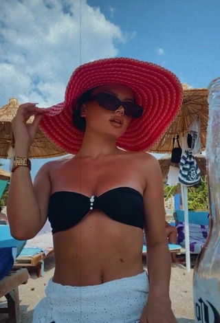 Sultry Grisela Shows Cleavage in Black Bikini Top at the Beach