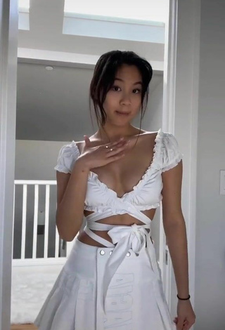 Sweetie Isaasung Shows Cleavage in White Crop Top