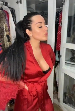 Sultry Laura Lempika Shows Cleavage in Red Bathrobe