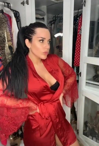 2. Sultry Laura Lempika Shows Cleavage in Red Bathrobe