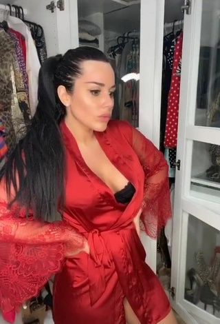 3. Sultry Laura Lempika Shows Cleavage in Red Bathrobe