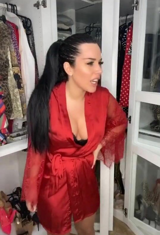 5. Sultry Laura Lempika Shows Cleavage in Red Bathrobe