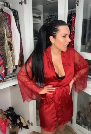 6. Sultry Laura Lempika Shows Cleavage in Red Bathrobe