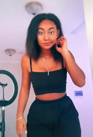 Titillating Elizabeth Anorue Shows Cleavage in Black Crop Top