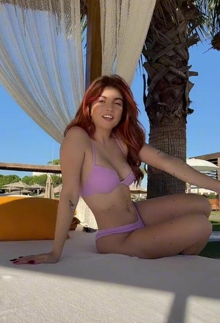 Sultry Lorena Visan Shows Cleavage in Purple Bikini