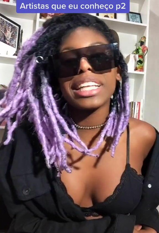 Sultry MC Soffia Shows Cleavage in Black Bra