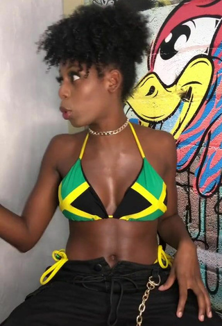 5. Titillating MC Soffia Shows Cleavage in Bikini Top