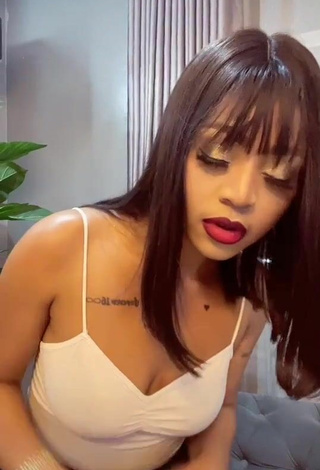 Sultry Regina Daniels Shows Cleavage in White Top