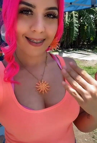 Sultry Paulytenosant Shows Cleavage in Orange Top