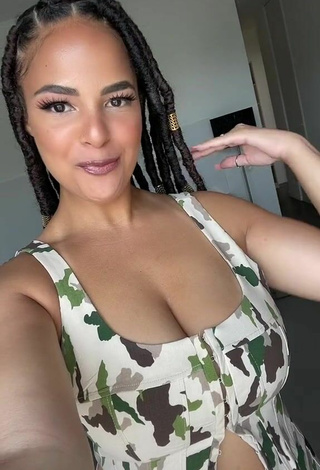 Sultry peachy.mely Shows Cleavage in Camouflage Crop Top