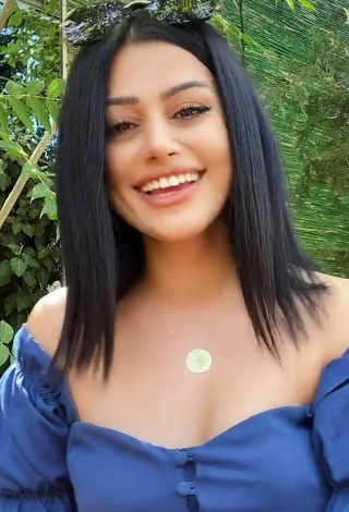 3. Sultry Arzu Kalkan in Blue Top