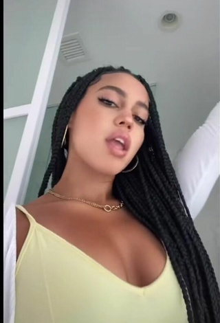 4. Luscious Asia Monet Ray Shows Cleavage in Yellow Top