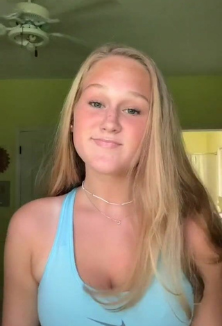 Cute Caiti Mackenzie Shows Cleavage in Blue Sport Bra