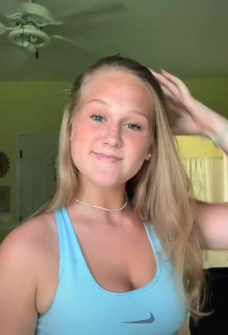 4. Cute Caiti Mackenzie Shows Cleavage in Blue Sport Bra