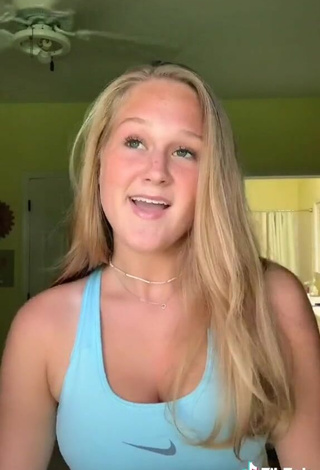 5. Cute Caiti Mackenzie Shows Cleavage in Blue Sport Bra