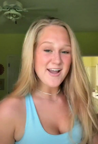 6. Cute Caiti Mackenzie Shows Cleavage in Blue Sport Bra