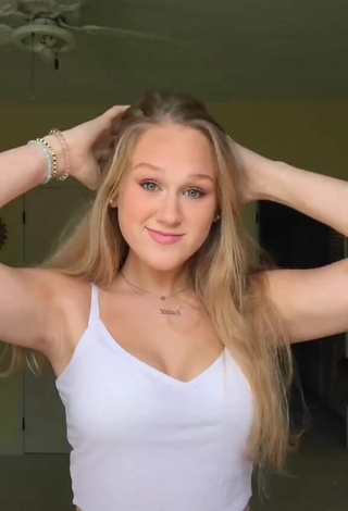 Luscious Caiti Mackenzie Shows Cleavage in White Crop Top