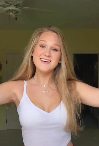 2. Luscious Caiti Mackenzie Shows Cleavage in White Crop Top