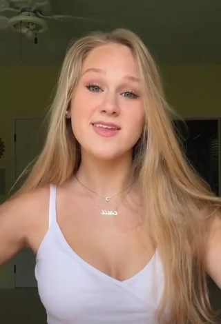 4. Luscious Caiti Mackenzie Shows Cleavage in White Crop Top