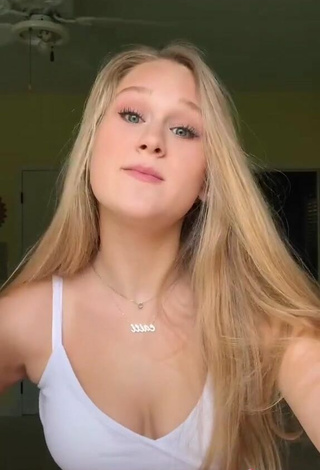 6. Luscious Caiti Mackenzie Shows Cleavage in White Crop Top