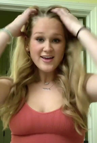 5. Luscious Caiti Mackenzie Shows Cleavage in Red Top