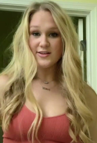 6. Luscious Caiti Mackenzie Shows Cleavage in Red Top