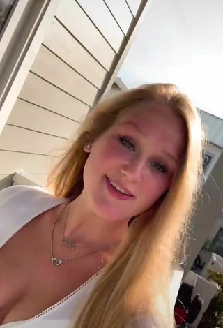 4. Sexy Caiti Mackenzie Shows Cleavage in White Crop Top