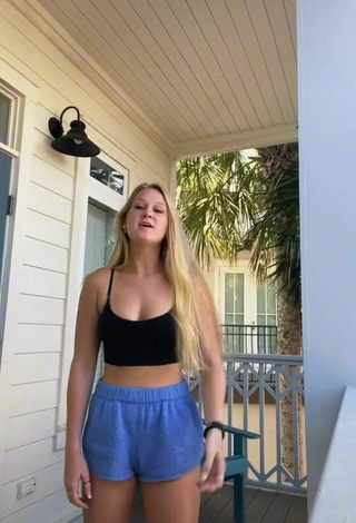 2. Hot Caiti Mackenzie Shows Cleavage in Black Crop Top